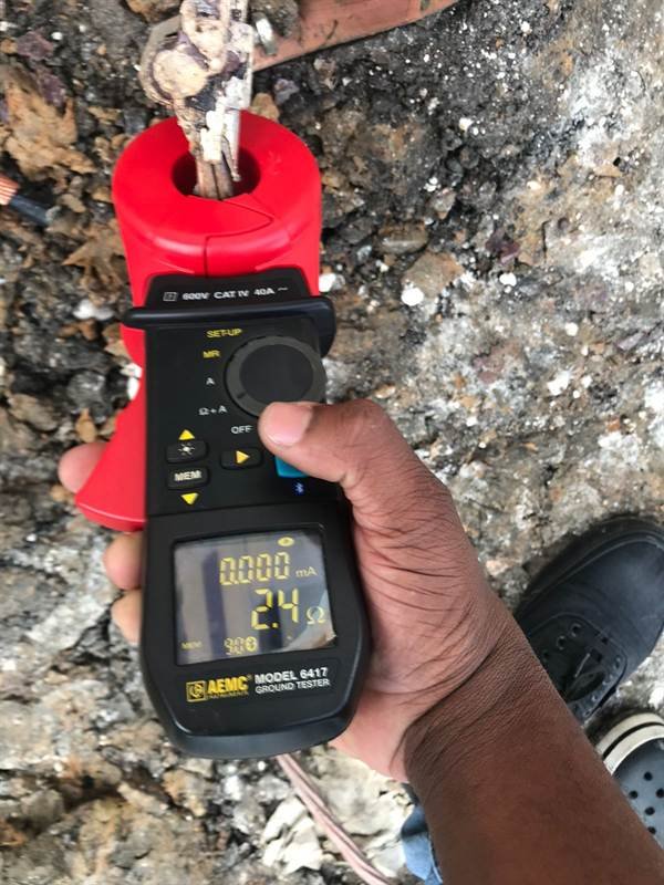 Technician using an earth resistance tester on site