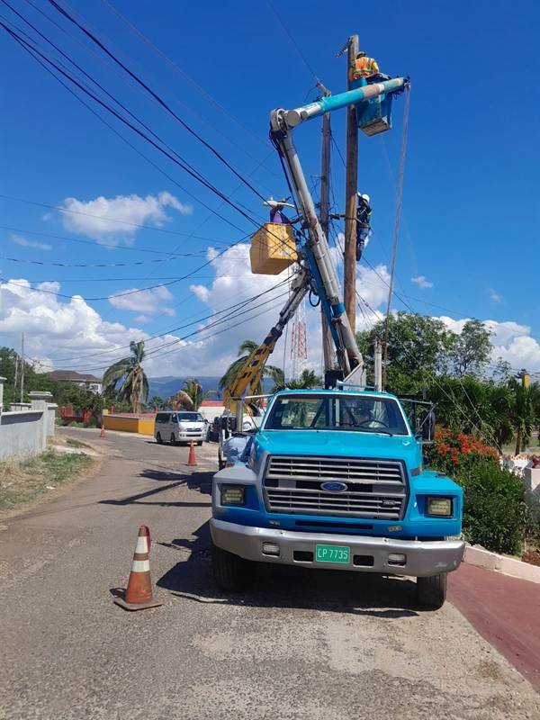 Alcopow bucket truck restoring power lines after Hurricane Melissa