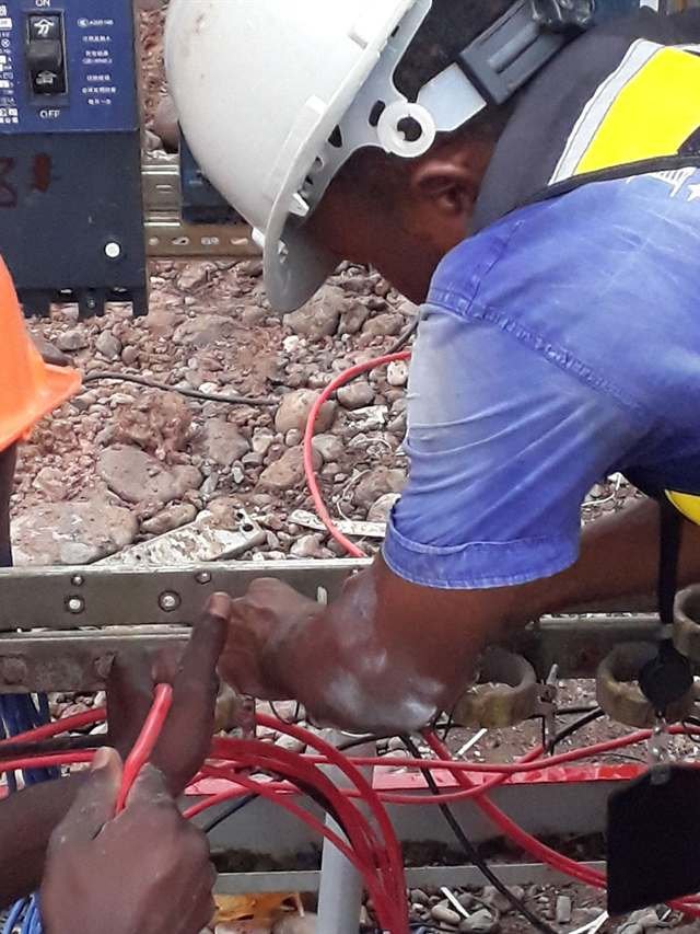 Alcopow electricians wiring a distribution panel on site